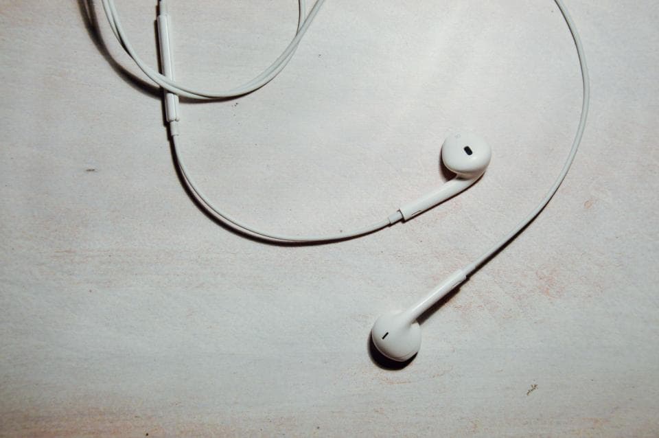 Wireless earbuds with protective cover